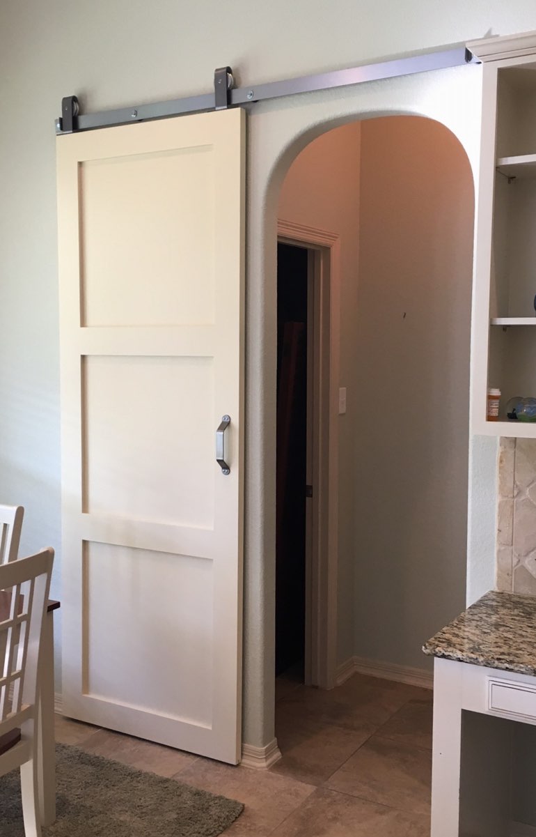 Shaker style barn door in Destin kitchen.